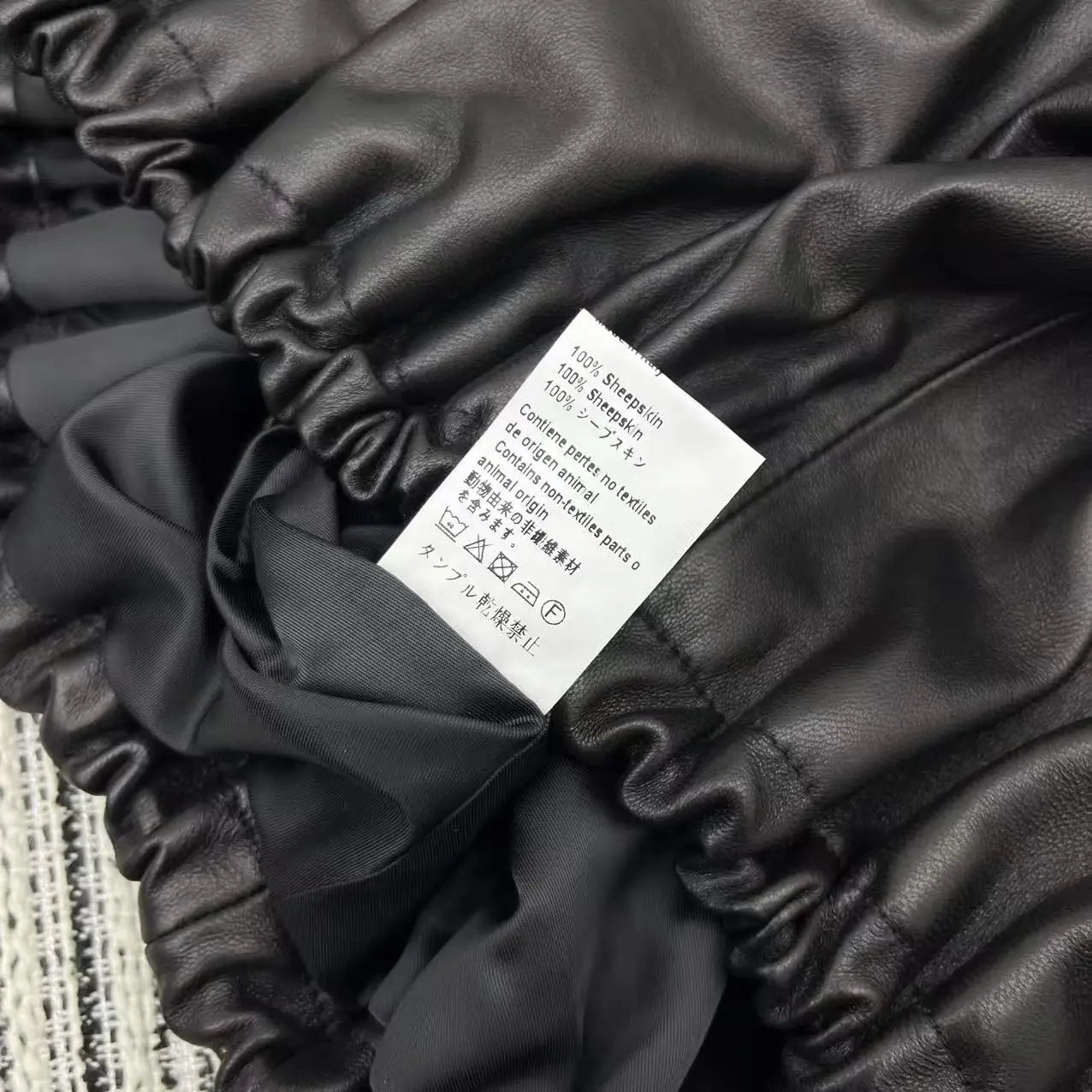 New black leather jacket for women in Spring 25 featuring zipper embroidery loose versatile sheepskin lapel genuine leather top